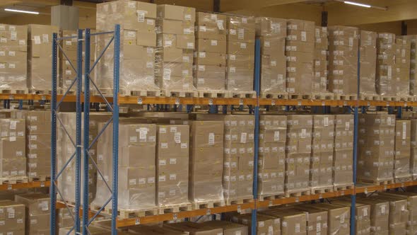 long pan of high racks filled with boxes in warehouse, Buildings Stock ...