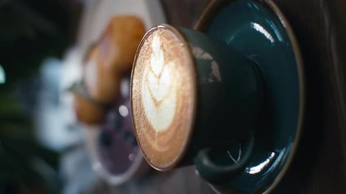 Background Vertical Video of a Cup of Cappuccino on a Table in a Cafe