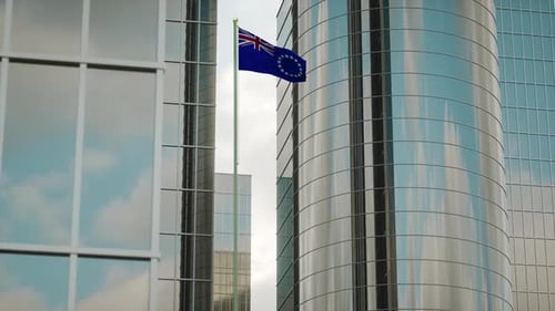 Cook Islands Flag Waving Between Modern Office Buildings