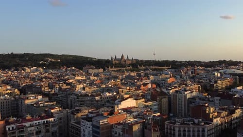 Barcelona majestic aerial drone view with Montjuic castle in distance, forward