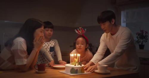 Happy Family Celebrates Birthday in Kitchen