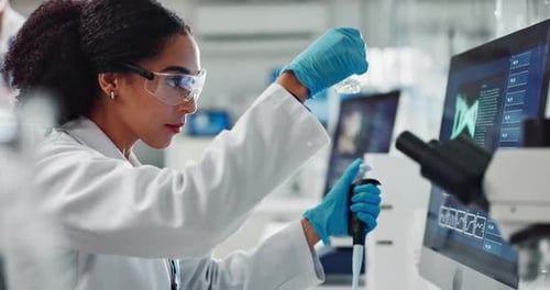 Female Scientist Working in a Bright Lab