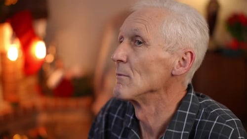 Closeup Sad Senior Caucasian Man Thinking Sitting Alone on Christmas at Home