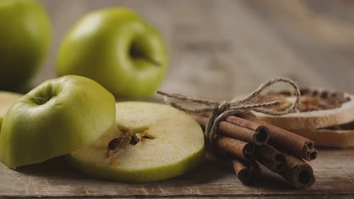 Apples and Cinnamon Still Life on Wooden Table