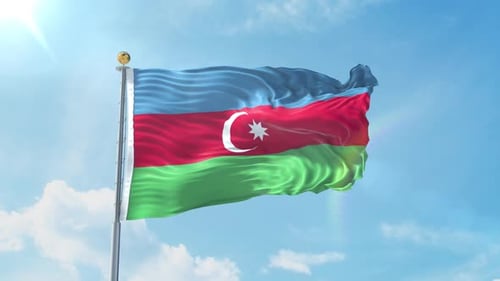 Waving Azerbaijan Flag in a Bright Blue Sky
