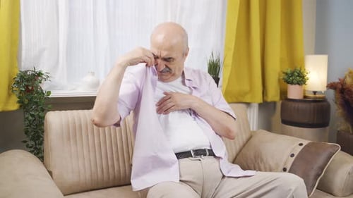The sweating old man smells bad and offensive.