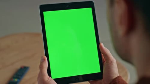 Unknown Man Watching Chroma Key Tablet at Desk Closeup Student Holding Device