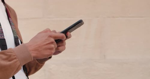 Close Up View of Male Hands Typing on Phone Screen Crop View of Man Usingsmartphone While Walking at