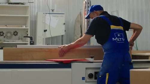 Manufacture of furniture on a joiner's machine. Creative. A special factory with workers in special