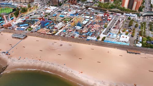 Distancing from almost empty sandy beach in Coney Island.