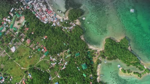 Aerial View of Tropical Malapascua Island Philippines Showing Coastline Boats and Lush Vegetation