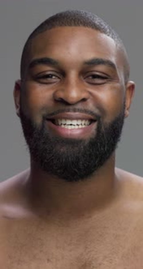 Studio, black man and face with confidence for skincare, grooming and beard with cosmetics