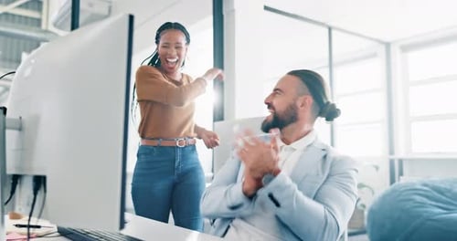 Successful Team Celebrates Great News at Office Computer