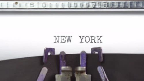 New York phrase closeup being typing and centered on a sheet of paper on old vintage typewriter