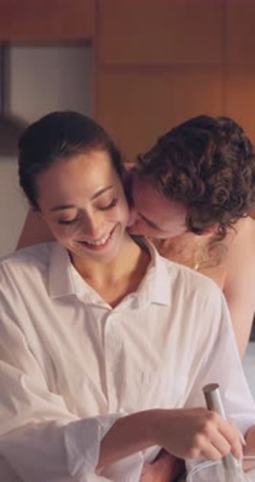 Loving Couple Cuddling in Kitchen