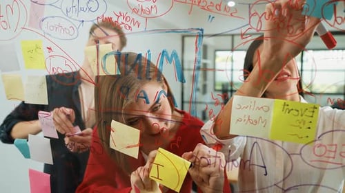 Team Collaboration: Professionals Brainstorming Ideas in Modern Office