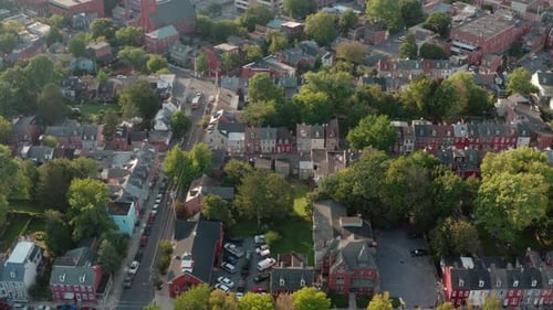 Aerial truck shot of American city during summer. Birds eye drone view.