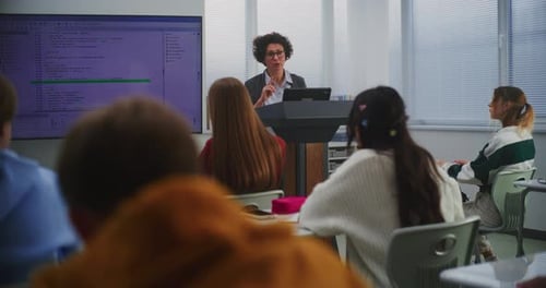 Students Listening to a Teacher in a Classroom