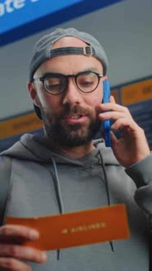 Airport Terminal Male Passenger Holding Plane Ticket Talking By Phone