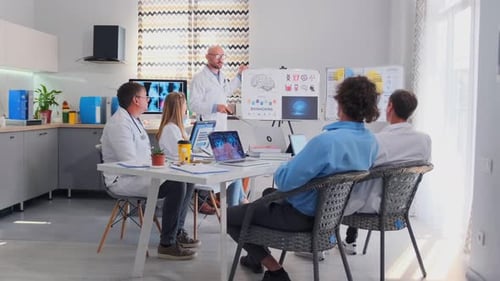 Medical Professionals Presenting Biohacking Research in Modern Office