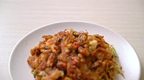 Delicious Oyster Omelet on Plate in Home Setting