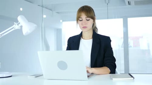 Woman Working on Computer in Office Has Headache