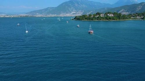 Beautiful view of the beach with boats, pure nature, sea and ships. Shot from a drone.