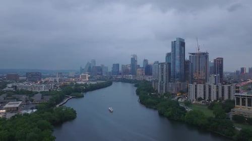 Aerial View of Austin Texas at Dusk Featuring Downtown Skyline High Rise Buildings and Scenic River