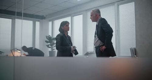 Detectives Investigate Crime Scene in Bright Office