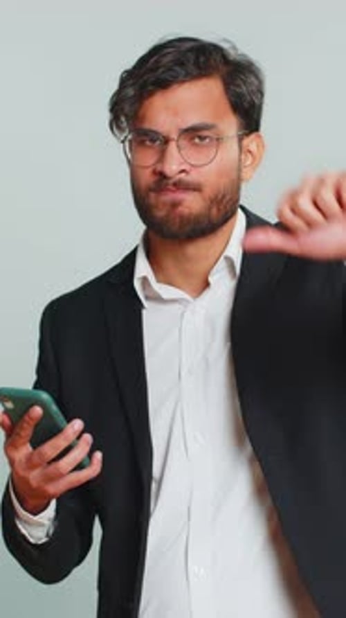 Man in Suit Receiving Bad News on Phone