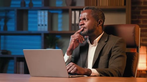Concentrated Businessman Typing on Laptop Pensive Thoughtful Man Thinking Deep in Thoughts Ponders