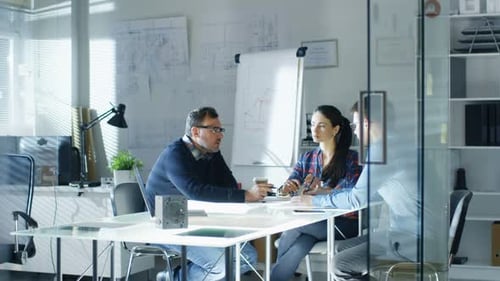 Morning Meeting of Design Engineers. Exchange of Ideas and Plans is Happening. Office Looks Bright