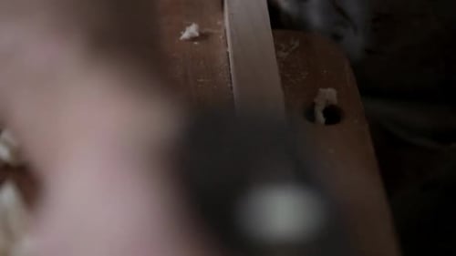 Close Up of Carpenter Using Plane Tool on Wood Block 3539 Years