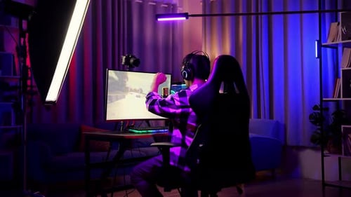 Asian Boy Streamer Celebrating Winning Game On Computer. Live Stream Video Game