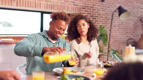 Friends and Family Enjoying Meal at Home