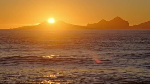 Sunrise Over Stormy Sea Shining Golden Waves with Sun Reflection at Sunset Amazing Light Over