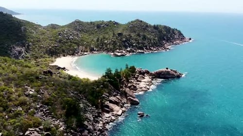 Aerial shot of the bays on Magnetic Island. Clear turquoise waters and rock formations.