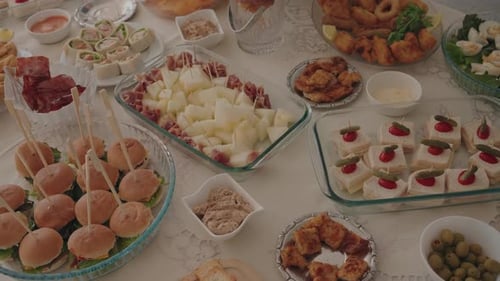 Assorted buffet appetizers arranged on festive table setting