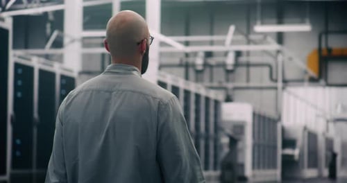 IT Specialist Conducting Physical Server Hall Inspection