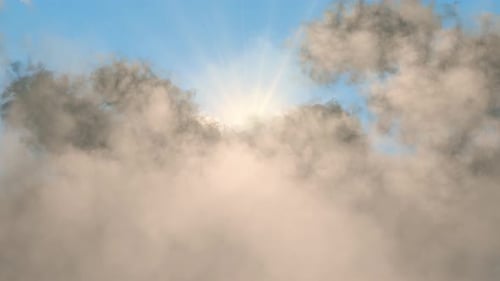 Golden Sun Rays Penetrate Through Heavenly Moving Clouds in Blue Sky