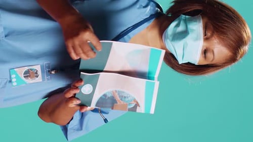 Nurse Presenting Medical Brochure