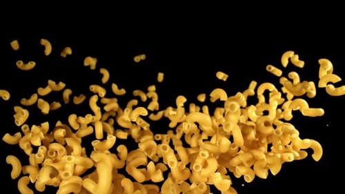 Elbow Macaroni Noodles Floating on a Black Background