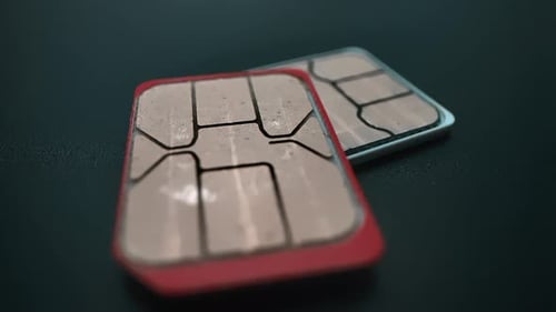 Close Up of SIM Cards on Dark Surface
