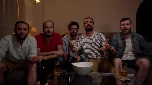 Enthusiastic Friends Watching TV in Living Room