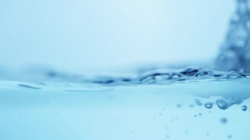 Clear blue water bubbles rise, creating a fresh and clean underwater scene with flowing ripples and