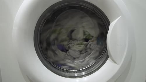 Clothes Spinning Inside of a Modern Washing Machine