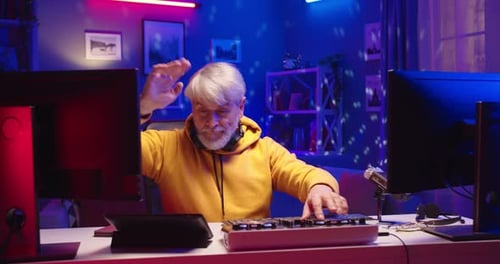 Senior Man Making Music With Midi Controller