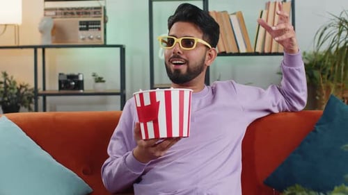 Man Watching Movie at Home with Popcorn