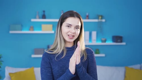 Cheerful Woman Clapping Hands Indoors