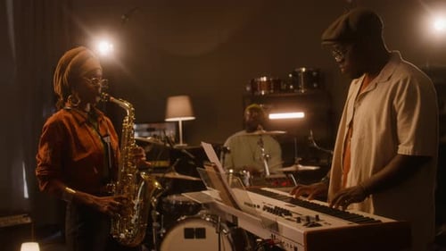 African American Jazz Band Having Jam Session in Studio